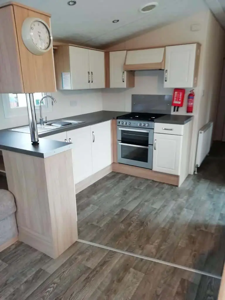 Europa Cypress 7 Europa Cypress compact modern kitchen area with clock.