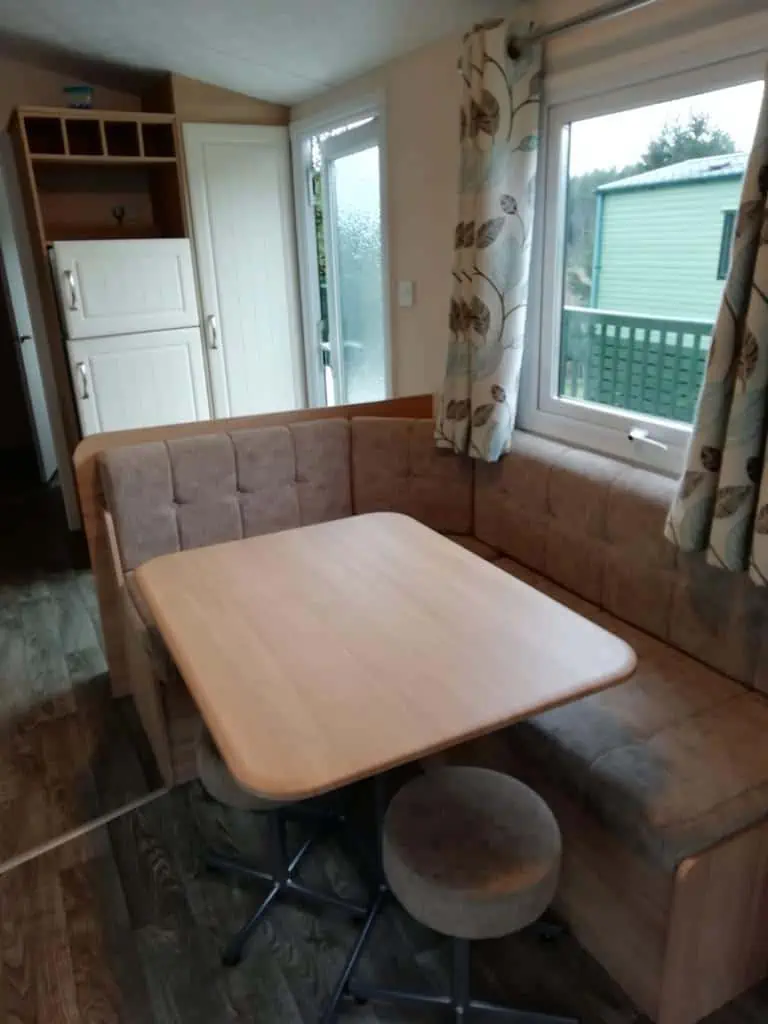 Europa Cypress 6 Europa Cypress modern dining area with wrap around sofa.