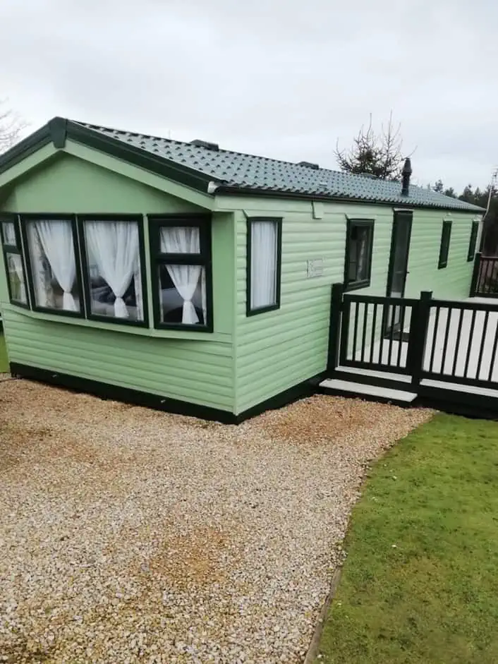 Europa Cypress 1 Europa Cypress outdoor view of beautiful mint coloured cozy, affordable, and family-friendly static caravan home.