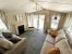 Europa Willow 5 Europa Willow beautiful bright airy lounge area with cozy sofas and electric fireplace
