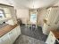 Europa Willow 3 Europa Willow modern dining and kitchen area with curtains and furniture