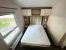 Europa Willow 10 Europa Willow master bedroom with two matching bedside drawers and built-in storage above bed