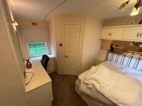 Atlas Sherwood Super 10 Master bedroom with desk, built-in storage, ensuite at affordable holiday home