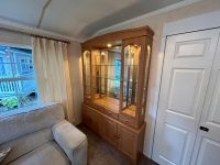 Atlas Sherwood Super 16 Traditional living room in family-friendly static home with illuminated display cabinet and comfortable seating