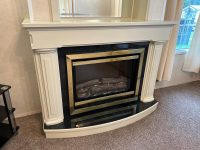 Atlas Sherwood Super 4 Elegant electric fireplace with classic white surround in cozy holiday caravan lounge