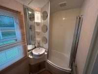 Atlas Sherwood Super 13 Bathroom with shower space in affordable, family-friendly static home.