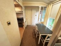 Atlas Sherwood Super 9 Comfortable dining area in affordable static home featuring neutral decor