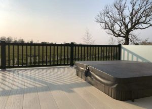 Outdoor jacuzzi on the outside deck of a static caravan. Investment Opportunity at Heathergate Boutique Holiday Park: Willerby Portland Lodge