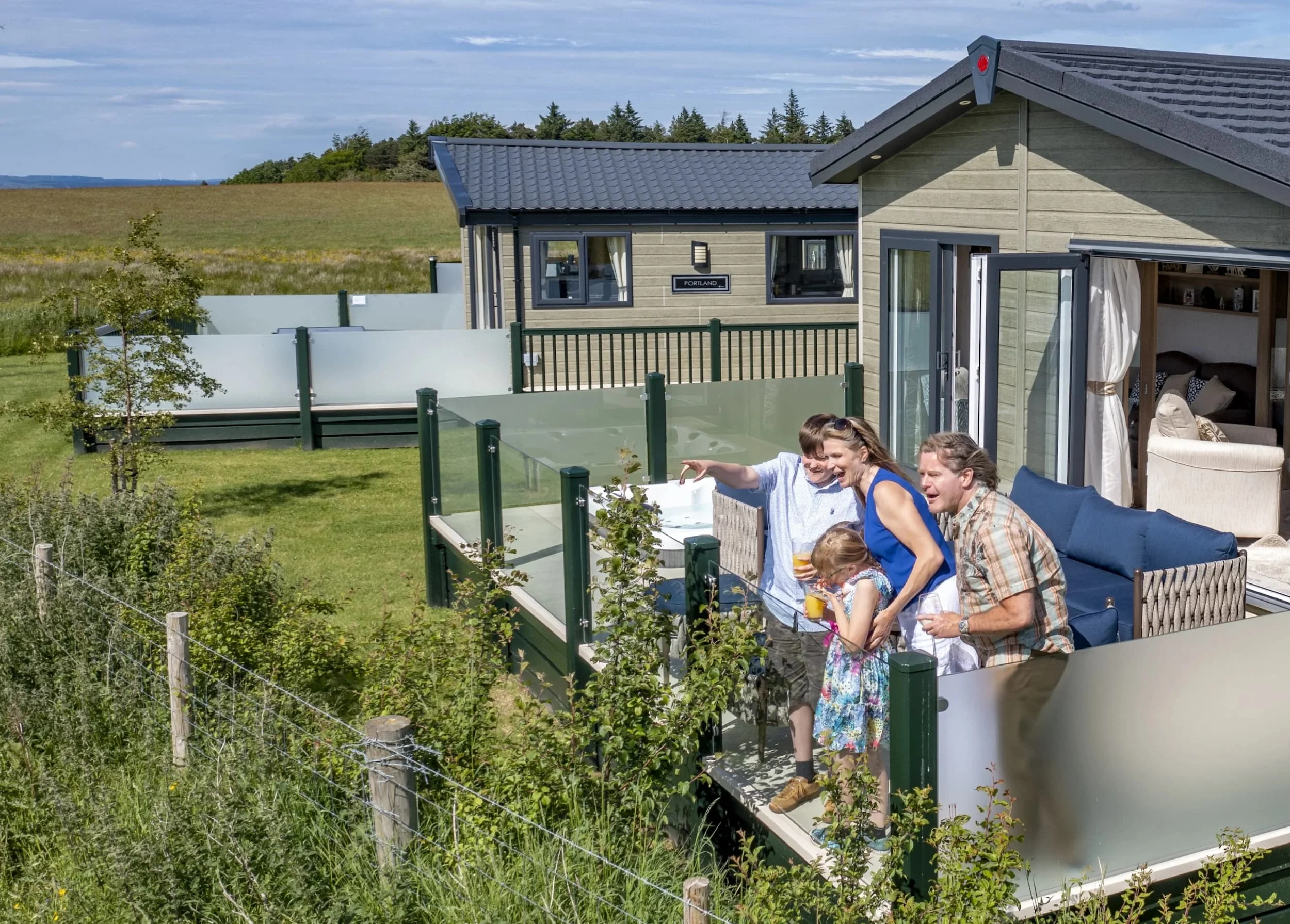 Northumberland's Holiday Home Parks 19 Couple enjoying their time in the kitchen area of a Heathergate lodge
